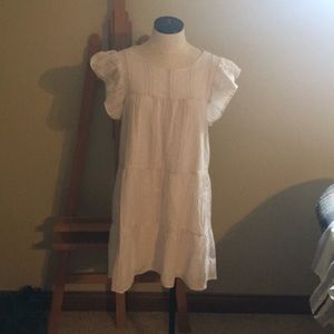 This is a white and tan striped baby doll dress